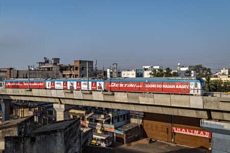 Rapid transit Hyderabad metro train enter Nampally station in the morning. The service has successfully completed one year in 2019のeditorial素材