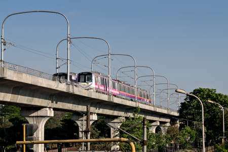 Pune,Maharashtra,India-March 12th,2020: Colorful, two rakes of Pune metro trial run, on the bridge.