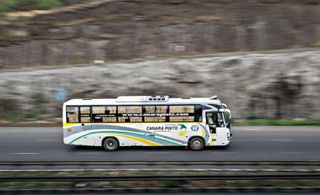 Pune, Maharashtra, India - June 3rd, 2018 : Blur, pan image of Canara Pinto travels bus , speeding...