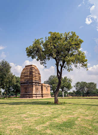 Ancient stone temple monument & tree at Pattadakal , Karnataka, India.の写真素材