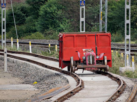 Shindawane,Maharashtra,India-November 29th,2020:Makeshift transportation arrangement during construction of new railway line in India. Tractor hauling train trolley.の写真素材