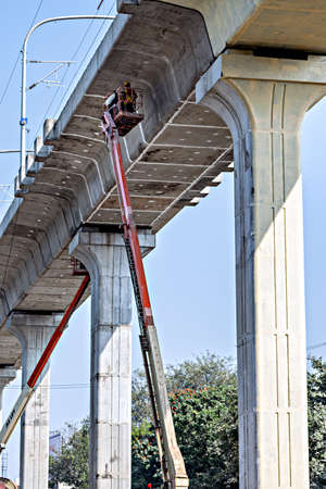 Pune, Maharashtra, India- January 4th 2022: Finishing work of Pune metro track is being done by...