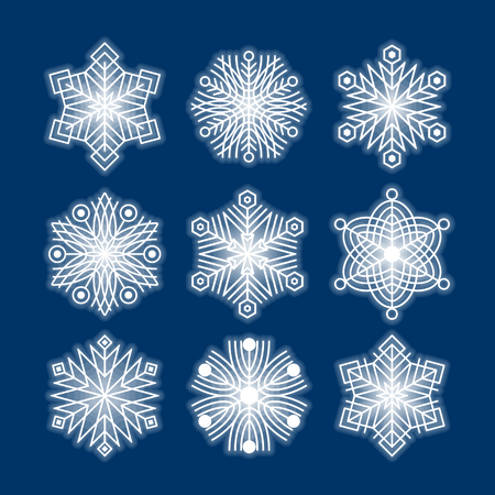 Set of white snowflakes silhouettes isolated on dark blue background, vector EPS10. Flat snow icons for christmas cards, banners, wrapping paper. Winter holiday Xmas or New Year 2019 decorationのイラスト素材