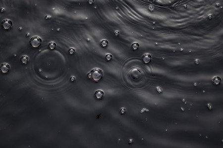 Abstract Background or Texture of Bubbles in Black Water Pond