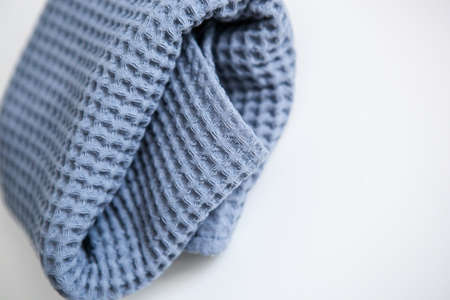 soft voluminous luxury blue towel on a white backgroundの写真素材