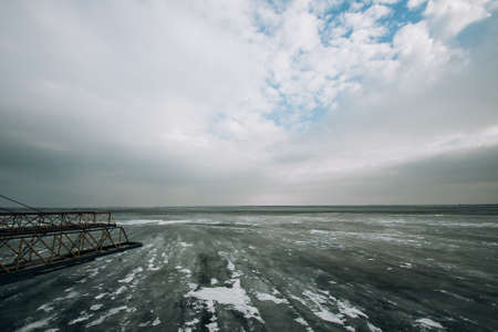 frozen water blue-green ice on the river. winter landscape with a pond.の写真素材