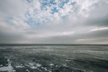 frozen water blue-green ice on the river. winter landscape with a pond.