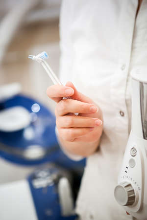 dentist shows nozzles for dental devices of personal oral hygiene