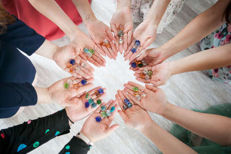 girls hold hands, female circle of power. unity, cohesionの写真素材