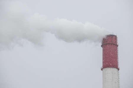 Ambient air pollution industrial emissions. steam from the boiler room pipes in the contoured light...
