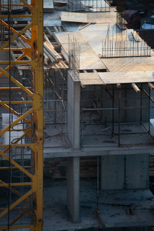 building under construction on a cold day, steam, frame, contrasting lightの写真素材