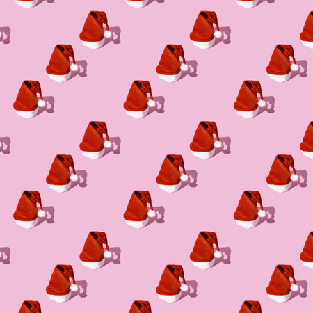 Santa Claus hat pattern on a pink background