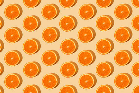 Monochromatic creative pattern made of fresh orange. Juicy citrus pastel background. Minimal concept