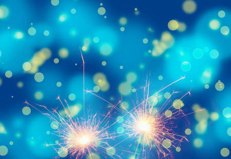 Burning sparklers on abstract snowy background. Happy new year. 3d illustration.の写真素材