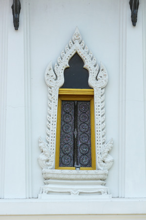 Thai temple golden windowの写真素材