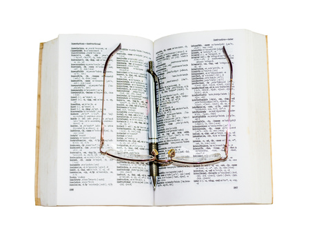 Dictionary, pen and Glasses with clipping path in white background