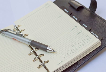 Leather notebook and penの写真素材