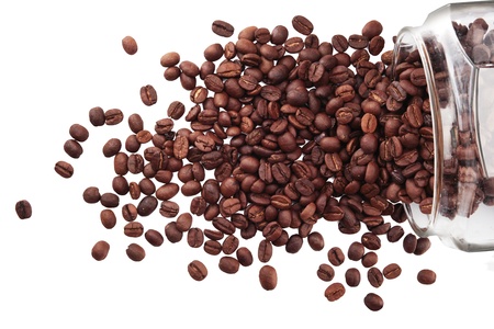 Coffee beans in a glass jar on white backgroundの写真素材