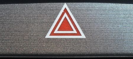 Interior car red white black and silver metal hazard sign