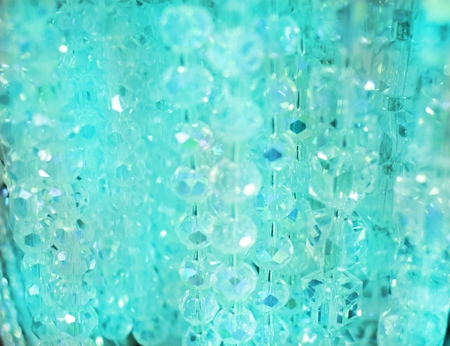 Teal blue sparkling clear beaded background with sophisticated gemsの写真素材