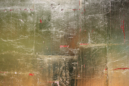 Leaf gold foil on a wooden background (1)の写真素材