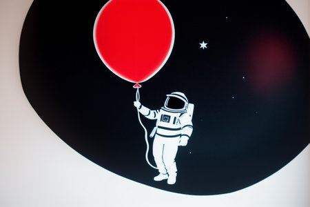Astronaut with balloon on the background of the night sky.の素材