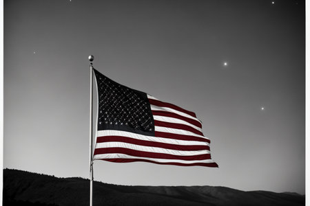 This image captures the essence of American patriotism with the iconic stars and stripes waving in the wind, symbolizing the strength and unity of the nation. . Generative AI.の素材
