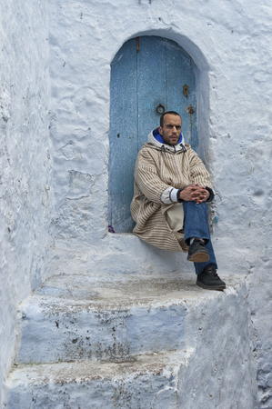 CHEFCHAOUEN, MOROCCO - FEBRUARY, 19 2017: Unidentified man in the blue medina of Chefchaouenのeditorial素材