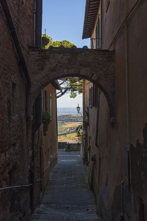MONTEPULCIANO - TUSCANY / ITALY, OCTOBER 29, 2016: Captivating narrow street of old Montepulciano town in Tuscany, Valdichiana - Val D'Orcia, Italyのeditorial素材