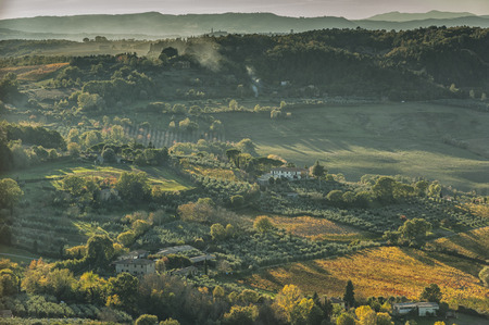 MONTEPULCIANO - TUSCANY / ITALY, OCTOBER 29, 2016: An idyllic landscape with a view over Montepulciano countryside, as seen from the town's top, bathed in the autumn sunset lightのeditorial素材