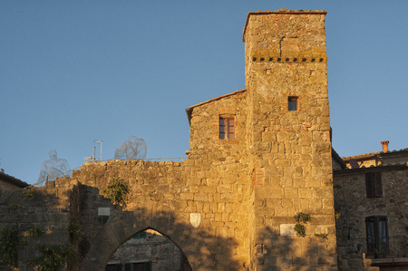 Montichiello - Italy, October 29, 2016: Quiet street in Montichiello, Tuscany with typical shuttered windows and paved streets. Monticchiello is the only fraction of the municipality of Pienza, in the province of Siena. It is a typical medieval village imのeditorial素材