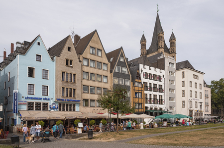COLOGNE, GERMANY - SEPTEMBER 11, 2016: Undefined people and colorful houses in the old town of Cologne, North Rhine-Westphaliaのeditorial素材