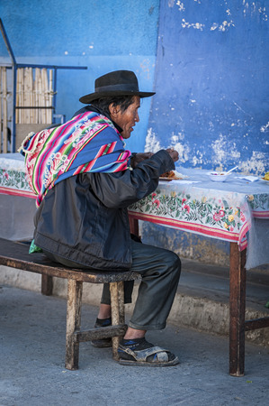 TARABUCO, BOLIVIA - AUGUST 06, 2017: Unidentified indigenous Yabara man with traditional clothing and hat, on the local Tarabuco Sunday Market, Bolivia - South Americaのeditorial素材