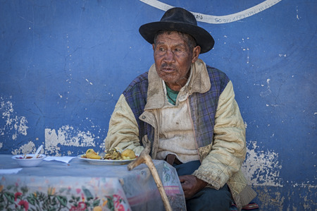 TARABUCO, BOLIVIA - AUGUST 06, 2017: Unidentified indigenous Yabara man with traditional clothing and hat, on the local Tarabuco Sunday Market, Bolivia - South Americaのeditorial素材