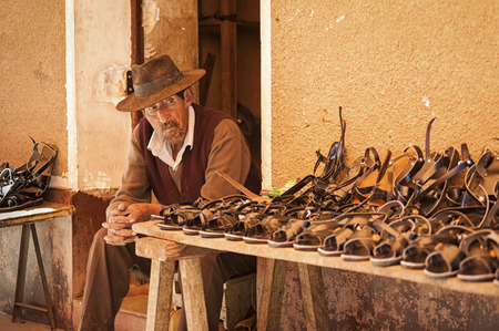 TARABUCO, BOLIVIA - AUGUST 06, 2017: Unidentified indigenous Yabara man with traditional clothing and hat, on the local Tarabuco Sunday Market, Bolivia - South Americaのeditorial素材