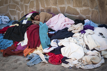 TARABUCO, BOLIVIA - AUGUST 06, 2017: Unidentified indigenous native Quechua woman with traditional tribal clothing and hat, at the local Tarabuco Sunday Market, Bolivia - South Americaのeditorial素材