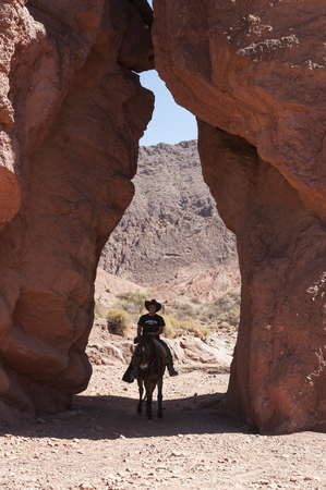 TUPIZA - BOLIVIA, AUGUST 09, 2017: Unidentified man riding in the beautiful Inca Canyon, near Tupiza, Bolivia - South Americaのeditorial素材