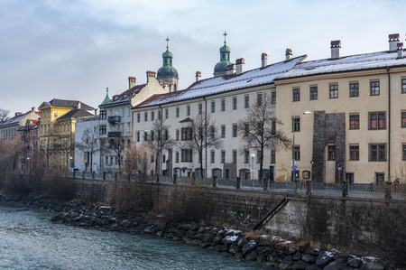INNSBRUCK, AUSTRIA - JANUARY, 01 2019: View of the old palaces with the St. James Cathedral towers on the river bank inn - Innsbruck, Tyrol Austriaのeditorial素材
