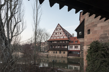 The famous Former Wine Depot (Weinstadel) and Water Tower (Wasserturm) over the river Pegnitz seen from Maxbr?cke - Nuremberg Germanyのeditorial素材
