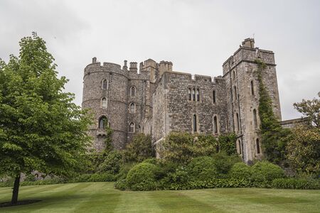 WINDSOR, ENGLAND -MAY, 24 2018: Windsor Castle, built in the 11th Century, is the residence of the British Royal Family at Windsor in the English county of Berkshire, United Kingdomのeditorial素材