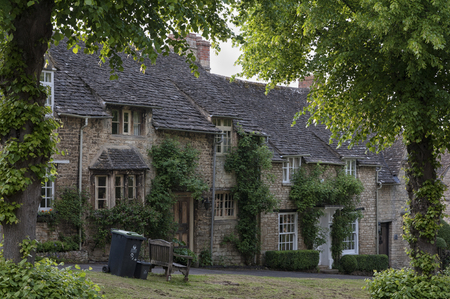 Quaint Cotswold romantic stone cottages on The Hill, in the lovely Burford village, Cotswolds, Oxfordshireのeditorial素材