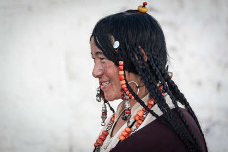SAMYE, TIBET, CHINA - AUGUST, 16 2018: Unidentified Tibetan lady pilgrimages to the Buddhist monastery of Samye, Tibet, Chinaのeditorial素材