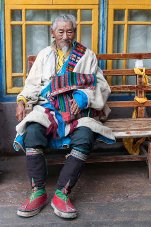 LHASA, TIBET - AUGUST 18, 2018: Tibetan Pilgrim inside the Jokhang Temple in Lhasa, Tibet. It is one of the famous Buddhist monasteries in Lhasaのeditorial素材