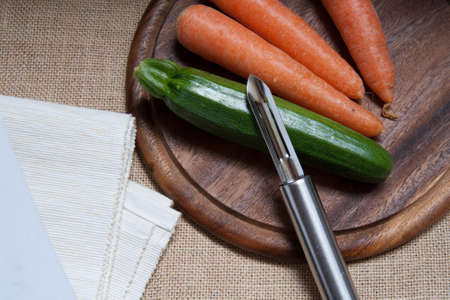 Vegetables composition on burplap surface with white napkinの写真素材