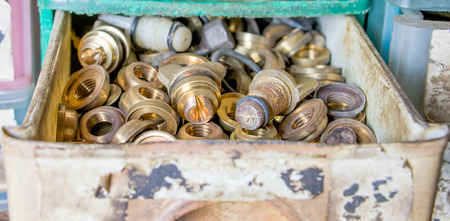 brass nuts in drawerの写真素材
