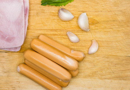 sausage on wooden backgroundの写真素材