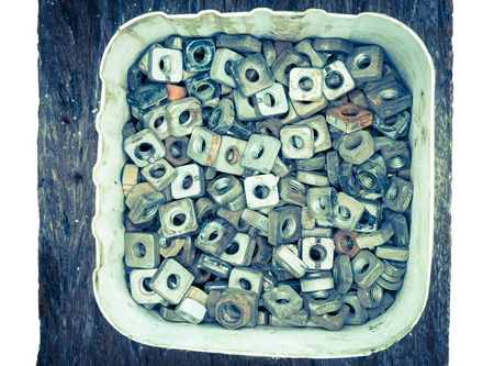 pile of screws on wood