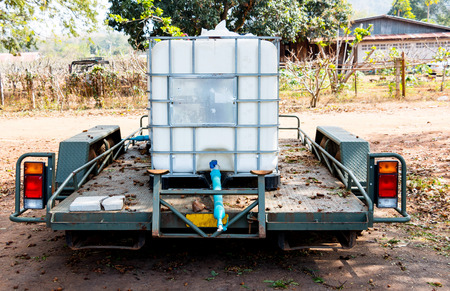 tank of water on wagon of truck