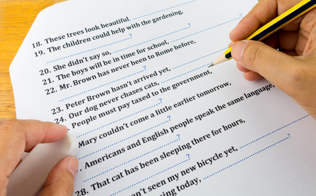 hands taking english testの写真素材