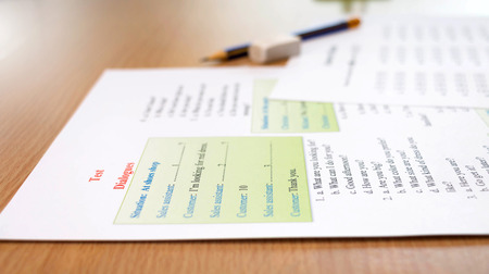 colorful english dialogues test on table